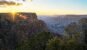 Layered cliffs of the Grand Canyon glowing in warm evening light in Arizona