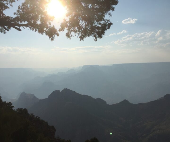 Sunlight breaking through smoky haze over Grand Canyon