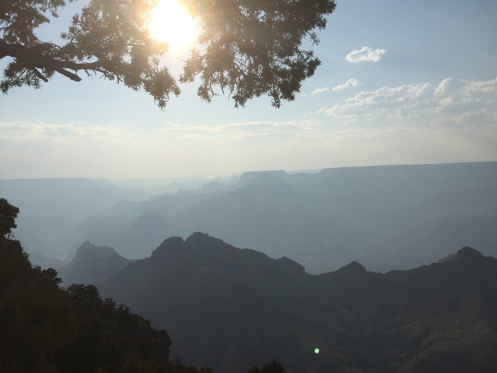 Sunlight breaking through smoky haze over Grand Canyon