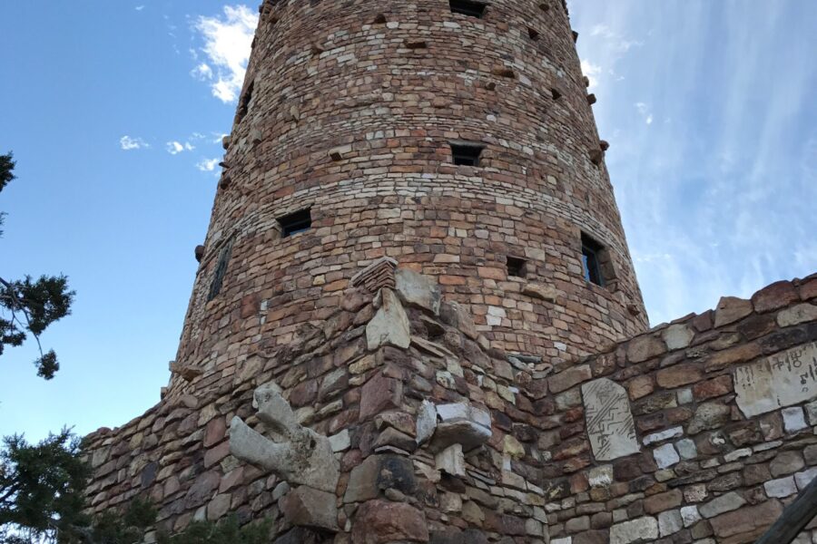 Stone Desert View Watchtower rising against a blue sky at the Grand Canyon South Rim