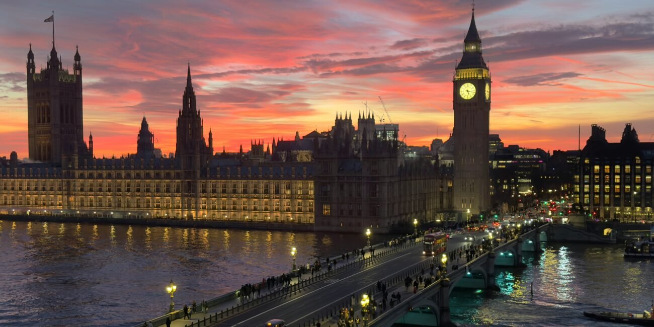 Westminster and Big Ben beside the River Thames at sunset in London