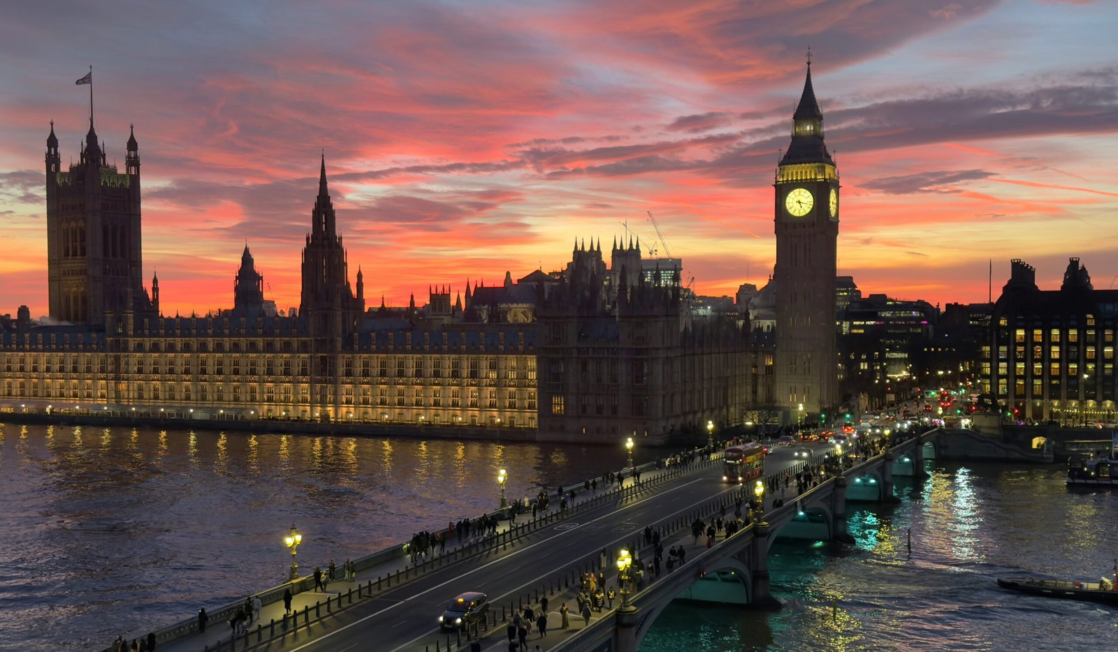 Westminster and Big Ben beside the River Thames at sunset in London