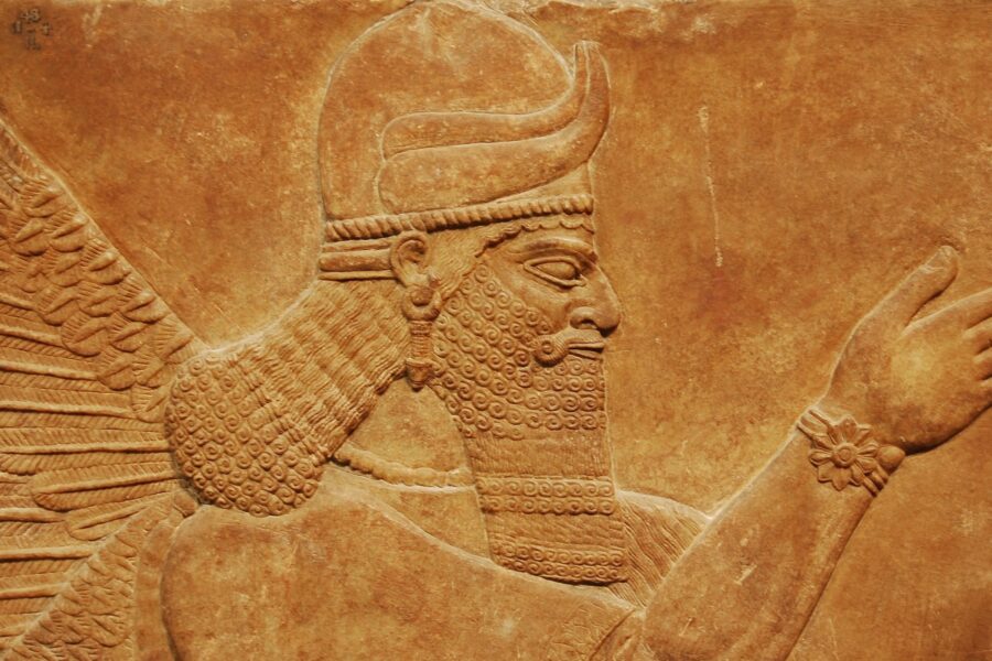 Close view of an ancient Assyrian palace relief in a London museum