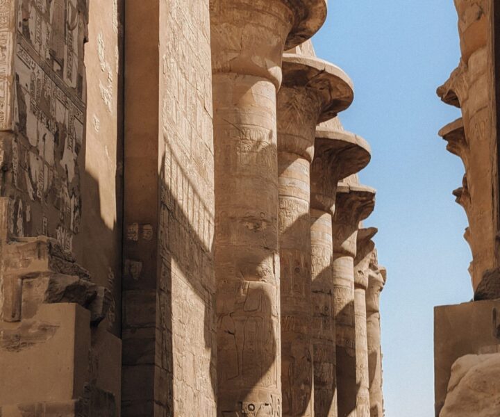 Ancient carved columns at Karnak Temple in Luxor, Egypt