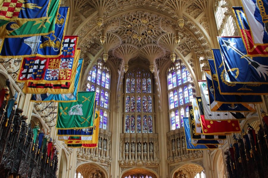 Gothic interior of Westminster Abbey in London with vaulted ceiling and historic flags