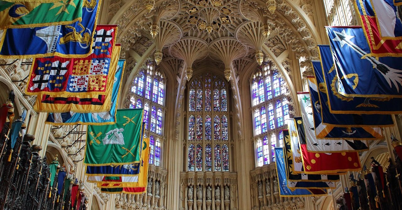 Gothic interior of Westminster Abbey in London with vaulted ceiling and historic flags