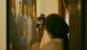 Museum visitor using a camera to photograph an artwork in a gallery