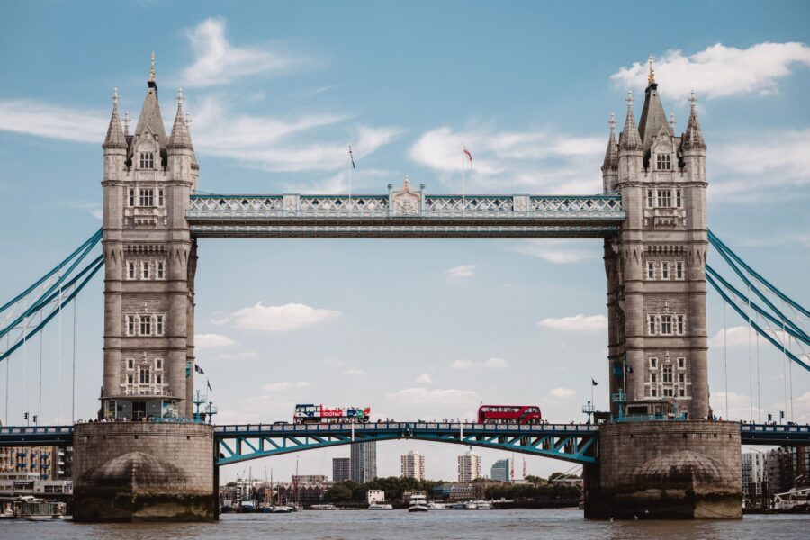 Tower Bridge spanning the River Thames beneath a blue sky in central London